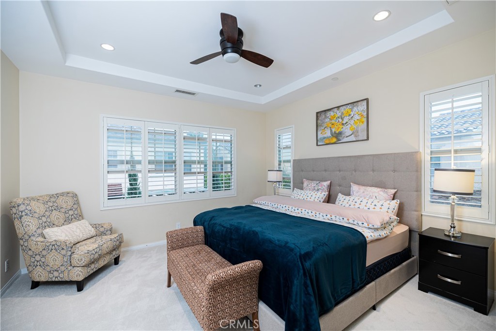 107 Overbrook Irvine, CA 92620 - Photo 45 of 47 a bedroom with a bed and couch