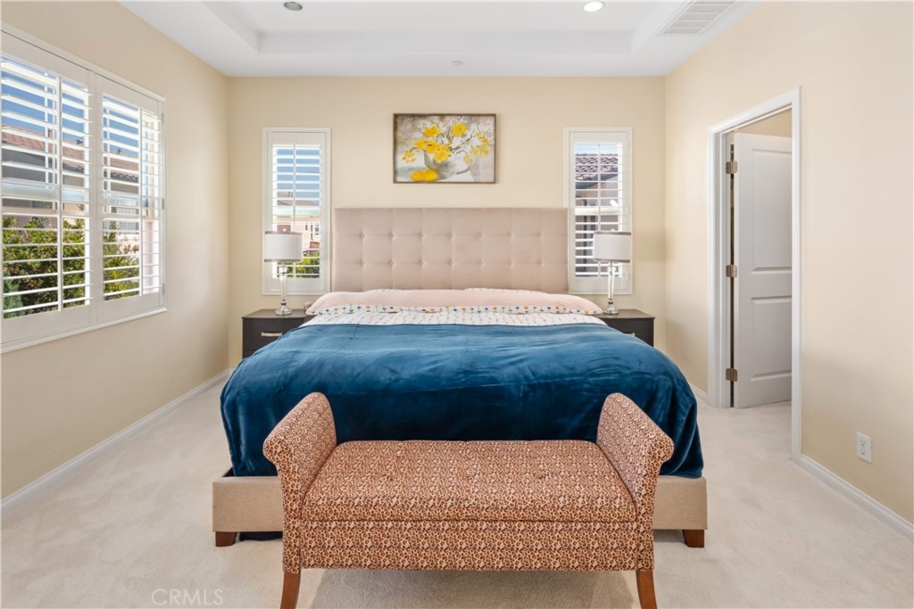 107 Overbrook Irvine, CA 92620 - Photo 10 of 47 a bedroom with a bed and a chair