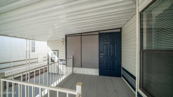 a kitchen with granite countertop a sink a stove and cabinets