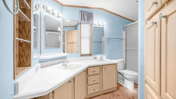 a view of a house with a yard table and chairs