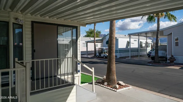 a view of a balcony with chairs