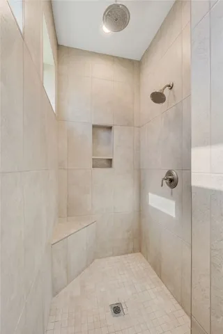 a bathroom with a tub shower