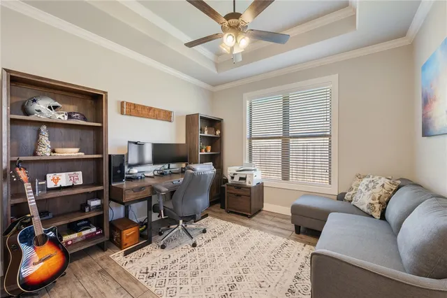 a work room with furniture and a window