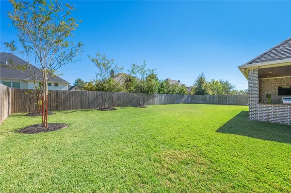 a view of a backyard with green space