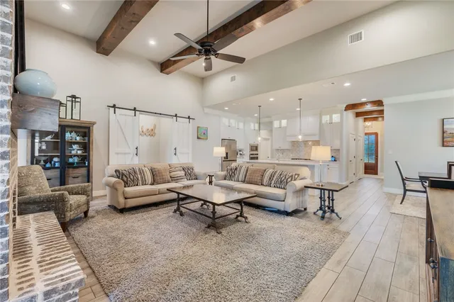 a living room with lots of furniture and a rug