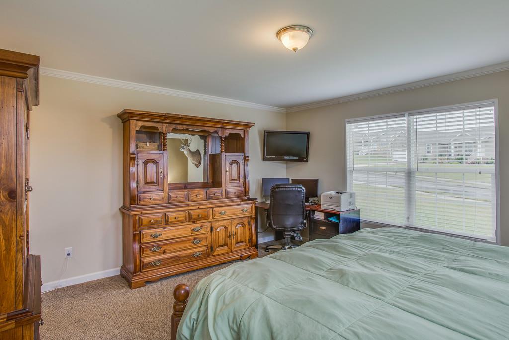 1142 Wrights Mill Road Spring Hill, TN 37174 - Photo 16 of 30 a bedroom with a bed and wooden floor