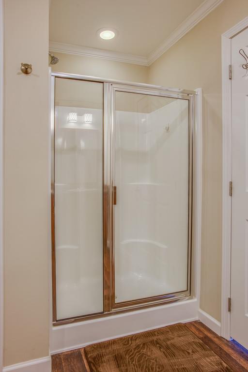 1142 Wrights Mill Road Spring Hill, TN 37174 - Photo 18 of 30 a view of bathroom with a glass door and a shower