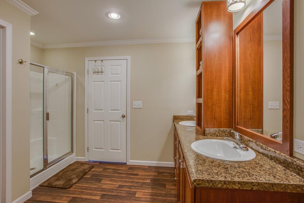 1142 Wrights Mill Road Spring Hill, TN 37174 - Photo 21 of 30 a bathroom with a granite countertop sink and a mirror