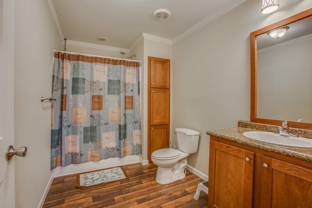 1142 Wrights Mill Road Spring Hill, TN 37174 - Photo 23 of 30 a spacious bathroom with a granite countertop sink toilet a mirror and shower