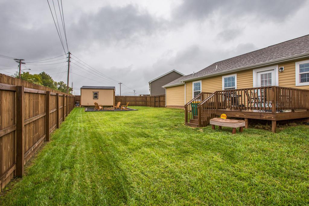 1142 Wrights Mill Road Spring Hill, TN 37174 - Photo 26 of 30 a view of a house with a yard and deck