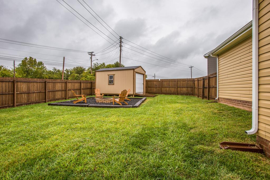 1142 Wrights Mill Road Spring Hill, TN 37174 - Photo 27 of 30 a view of a backyard with a garden and plants