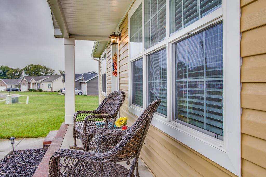 1142 Wrights Mill Road Spring Hill, TN 37174 - Photo 4 of 30 a chairs and a table in the patio next to a yard