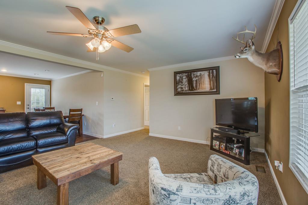 1142 Wrights Mill Road Spring Hill, TN 37174 - Photo 5 of 30 a living room with furniture and a flat screen tv