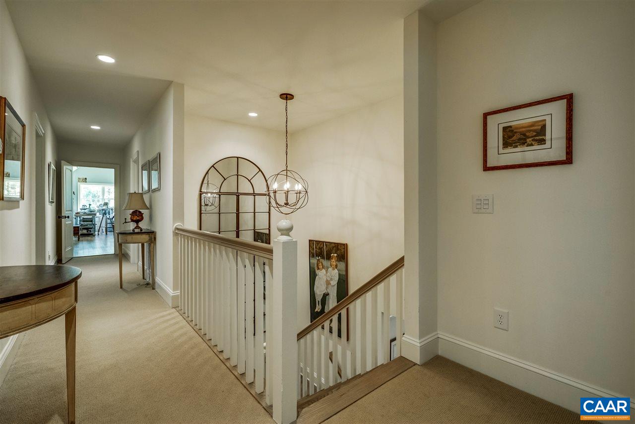 2845 Ridge Road Charlottesville, VA 22901 - Photo 33 of 50 a view of staircase with railing and a chandelier