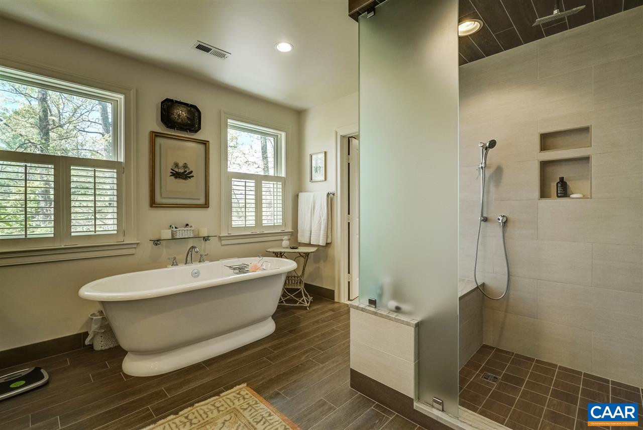 2845 Ridge Road Charlottesville, VA 22901 - Photo 38 of 50 a spacious bathroom with a tub sink and mirror