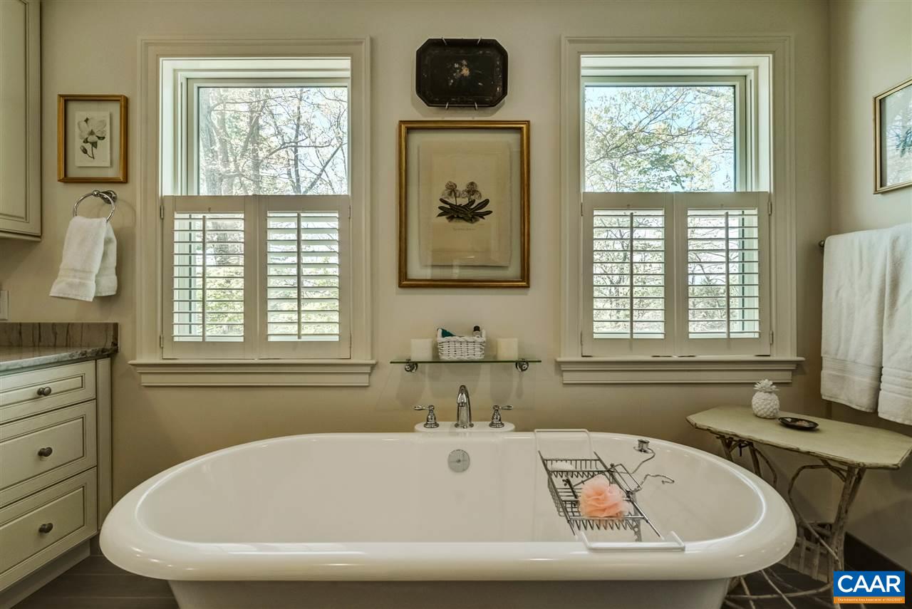 2845 Ridge Road Charlottesville, VA 22901 - Photo 39 of 50 a bathroom with a tub a sink and a window