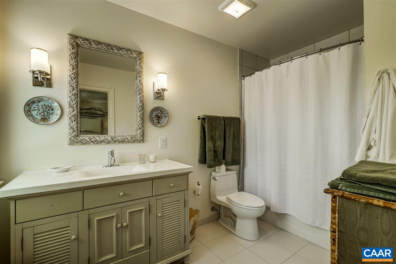 2845 Ridge Road Charlottesville, VA 22901 - Photo 42 of 50 a bathroom with a toilet sink and mirror