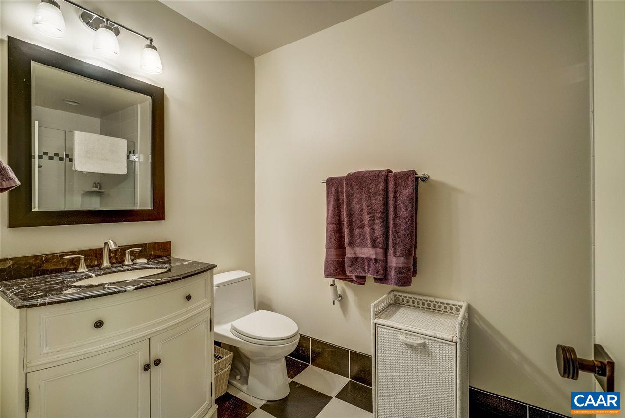 2845 Ridge Road Charlottesville, VA 22901 - Photo 44 of 50 a bathroom with a toilet sink vanity and mirror