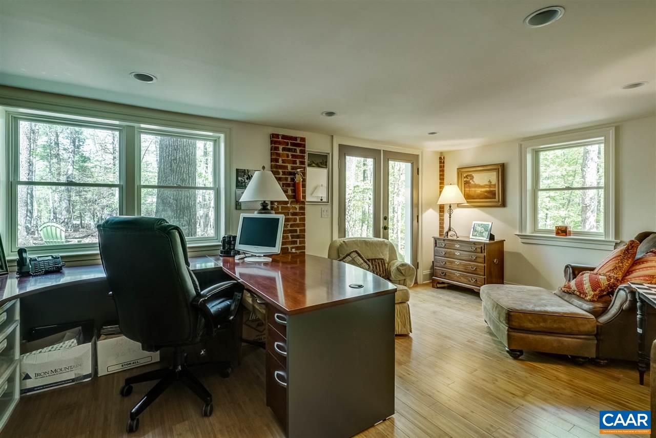 2845 Ridge Road Charlottesville, VA 22901 - Photo 46 of 50 a living room with furniture and floor to ceiling windows