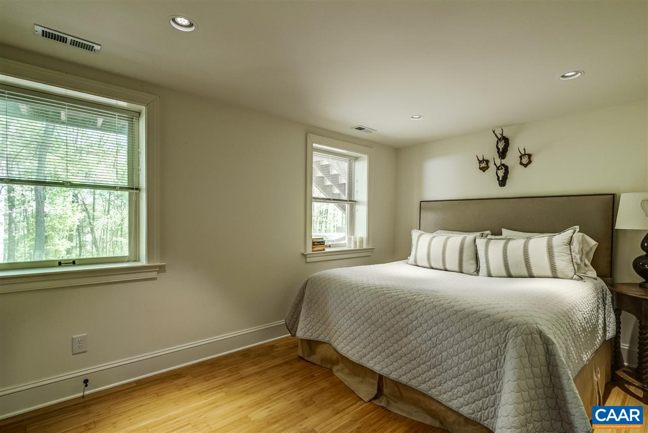 2845 Ridge Road Charlottesville, VA 22901 - Photo 49 of 50 a large bed sitting in a bedroom next to a window