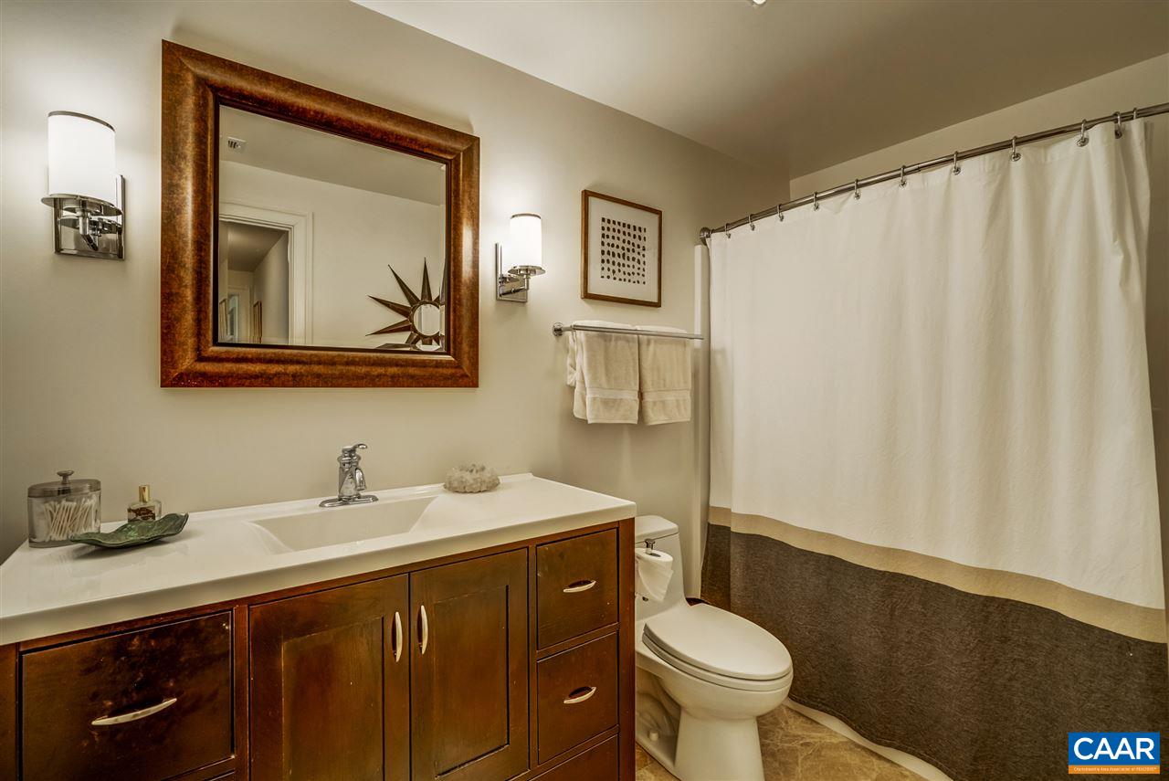 2845 Ridge Road Charlottesville, VA 22901 - Photo 50 of 50 a bathroom with a sink a toilet and a mirror