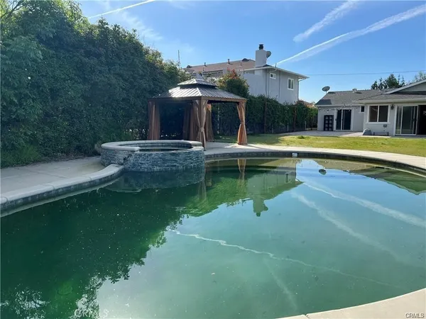 a view of a house with a swimming pool
