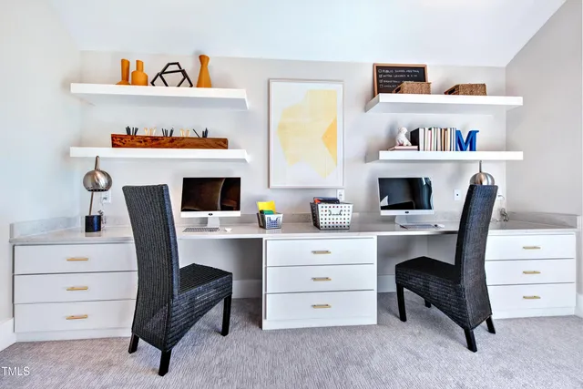 a view of a workspace with furniture