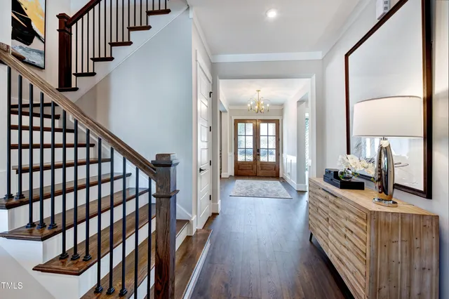 a view of an entryway wooden floor and front door
