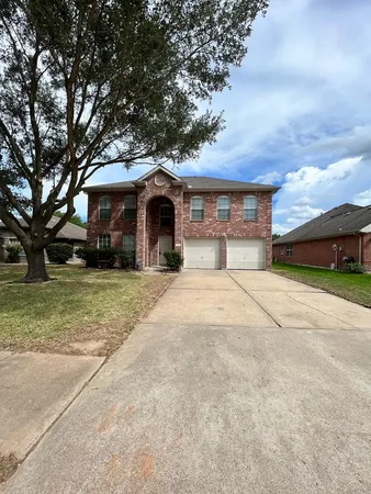 a view of house with yard and entertaining space