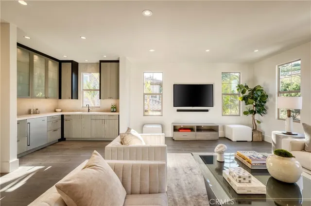 a view of a house with pool fire pit and chairs in front of it