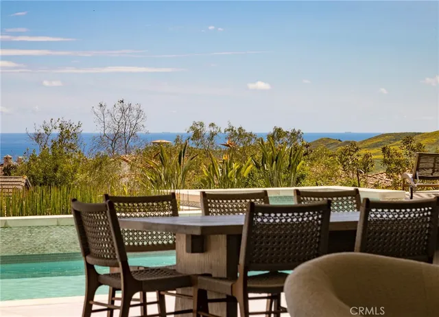 a view of a chairs and table in patio