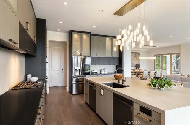 a kitchen with a sink stove and refrigerator