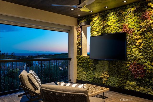 a bathroom with a sink a toilet and a large mirror