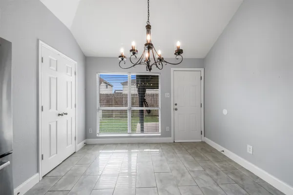 a view of a windows and chandelier in a room