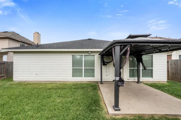 a view of backyard with cabin