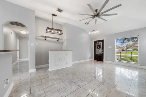 a view of an empty room with a window