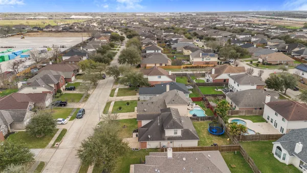 an aerial view of residential houses with outdoor space