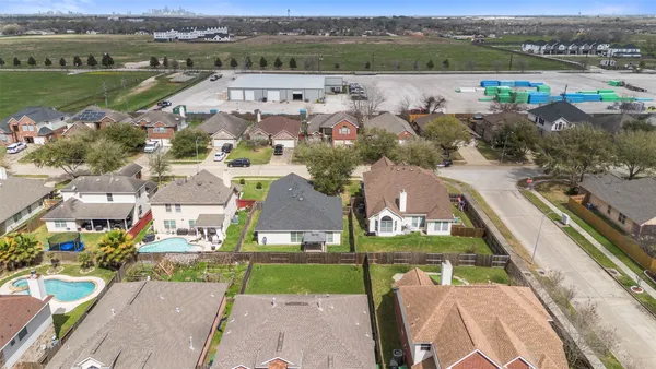 an aerial view of a house with a lake view
