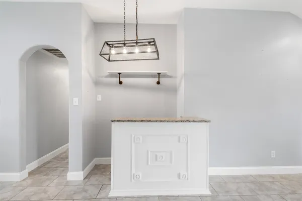 a view of a hallway with a stove