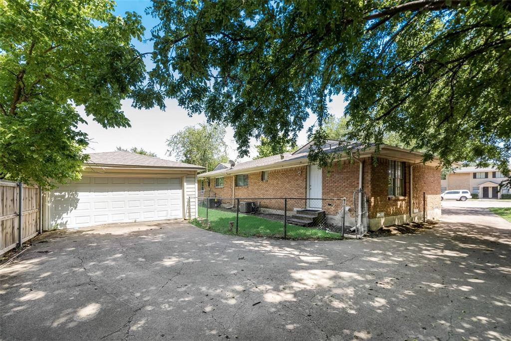 902 Spring Valley Plaza, Unit A Richardson, TX 75080 - Photo 11 of 11 a view of a car park in front of a house