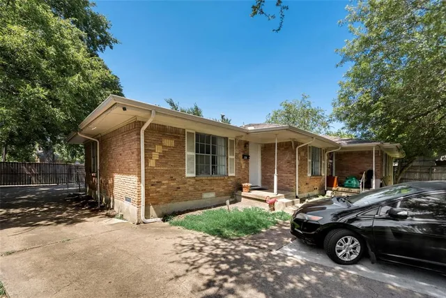 a car parked in front of a house