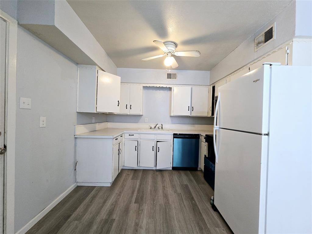 902 Spring Valley Plaza, Unit A Richardson, TX 75080 - Photo 6 of 11 a kitchen with a refrigerator a sink and dishwasher