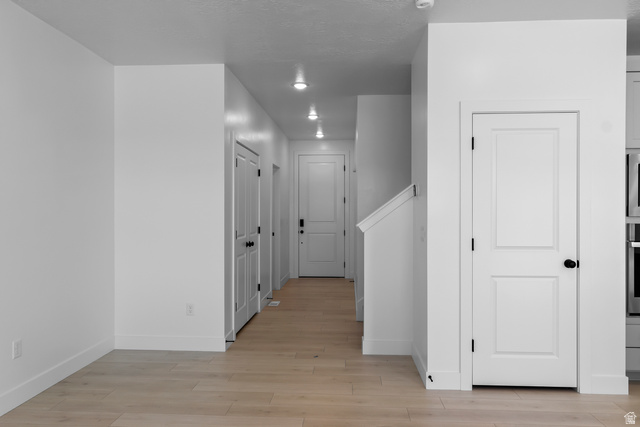2770 West Aurora Avenue Mapleton, UT 84664 - Photo 3 of 16 Hall featuring baseboards and light wood-style flooring