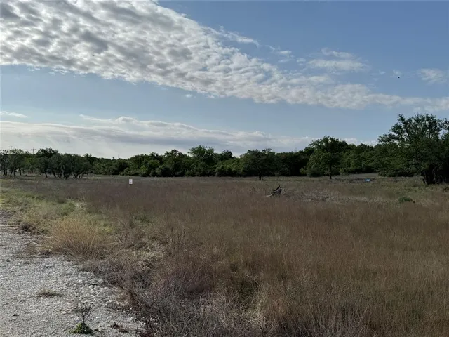 a view of a lake and yard