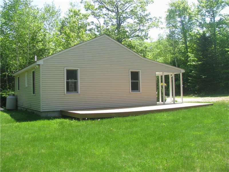 94 Hawkes Road Sebago, ME 04029 - Photo 3 of 24 Exterior Side View.