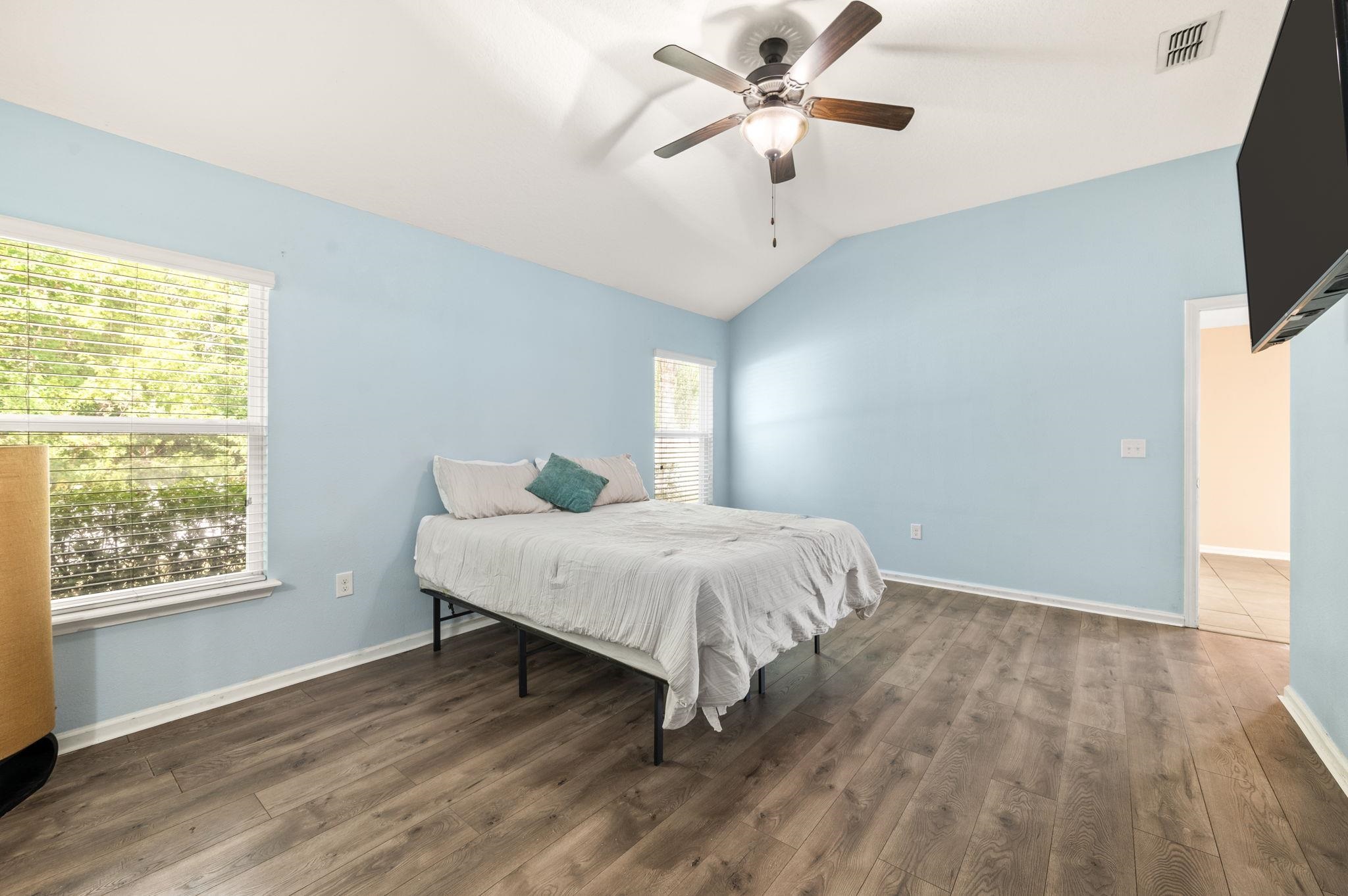 509 Deer Crossing Road St. Augustine, FL 32086 - Photo 19 of 54 a spacious bedroom with a bed and a window