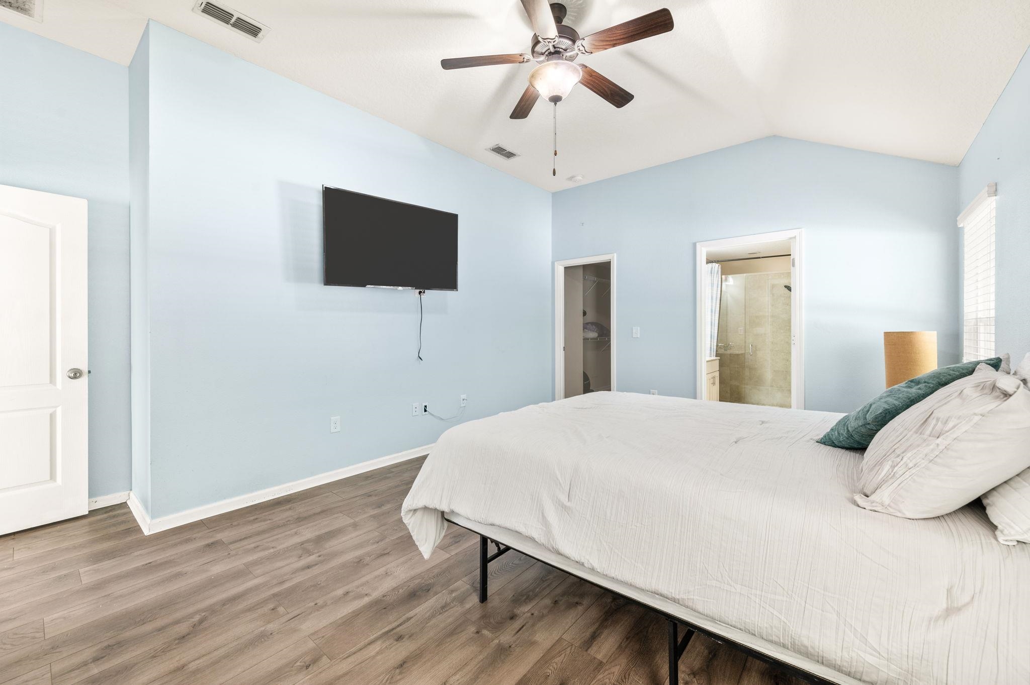 509 Deer Crossing Road St. Augustine, FL 32086 - Photo 20 of 54 a bedroom with a bed and a flat screen tv