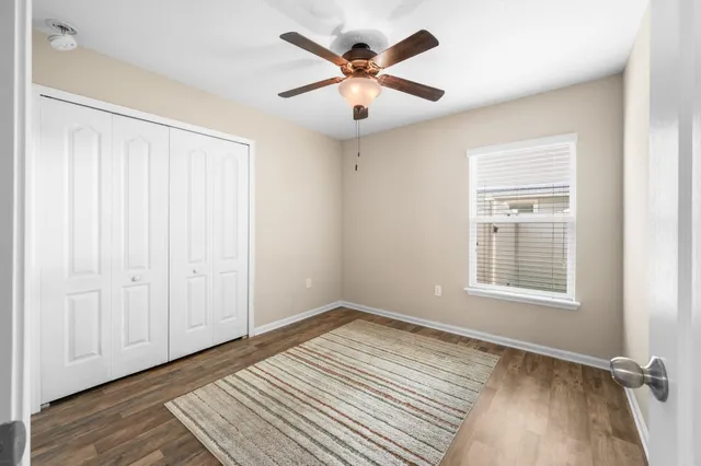 wooden floor in an empty room with a window