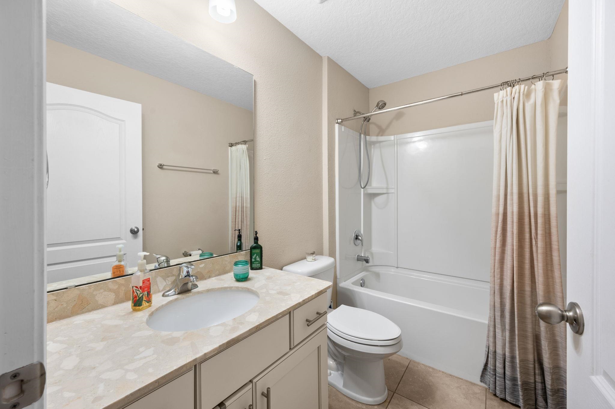 509 Deer Crossing Road St. Augustine, FL 32086 - Photo 29 of 54 a bathroom with a sink a toilet and shower