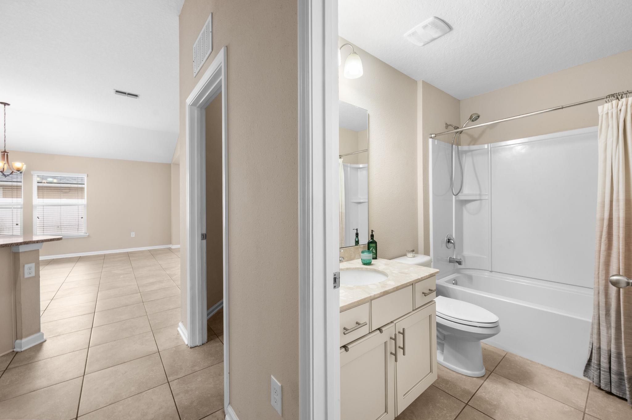 509 Deer Crossing Road St. Augustine, FL 32086 - Photo 30 of 54 a bathroom with a granite countertop sink toilet and shower